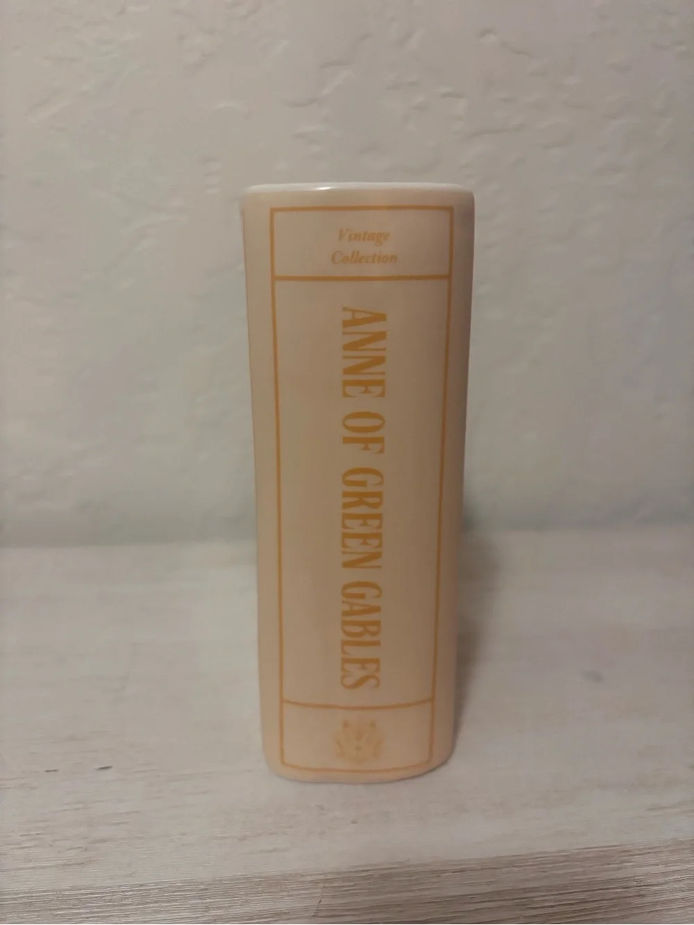 Anne of Green Gables book vase. ceramic book vase with vertical ribbed texture.